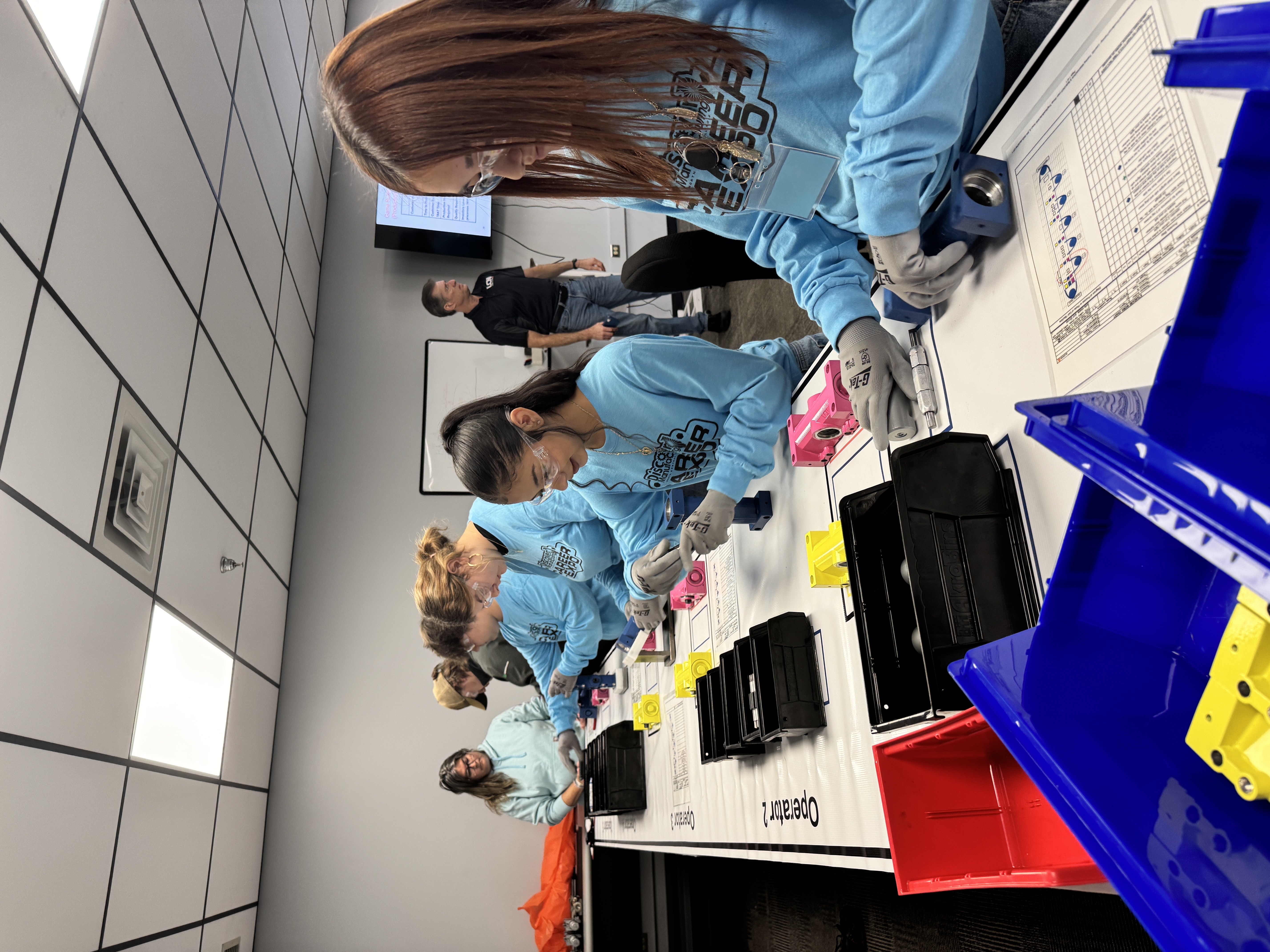 Students participate in mock assembly activity at the Manufacturing Day event at Allegion’s LCN facility in Princeton, Illinois.