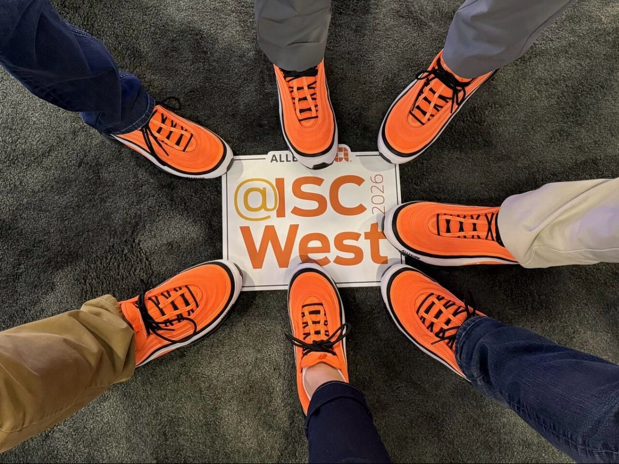 Allegion team members sport Allegion-branded shoes at ISC West.